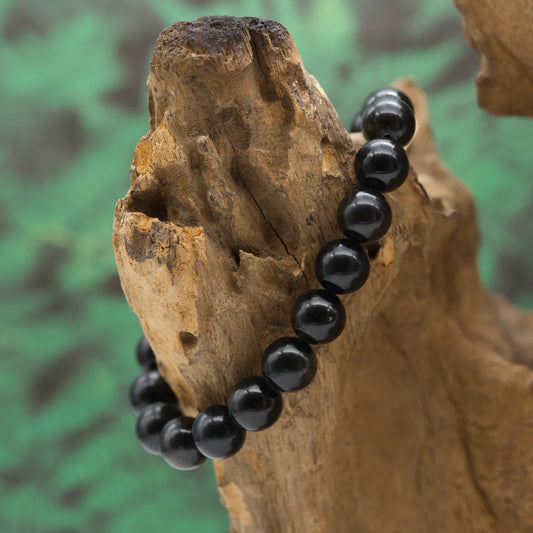 Edelstein-Armband aus 10 mm Goldobsidian-Perlen mit goldenem Schimmer – schützt und stärkt das innere Gleichgewicht.