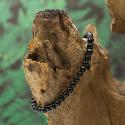 Schillernder Regenbogenobsidian – Schutz, emotionale Heilung und innere Balance.